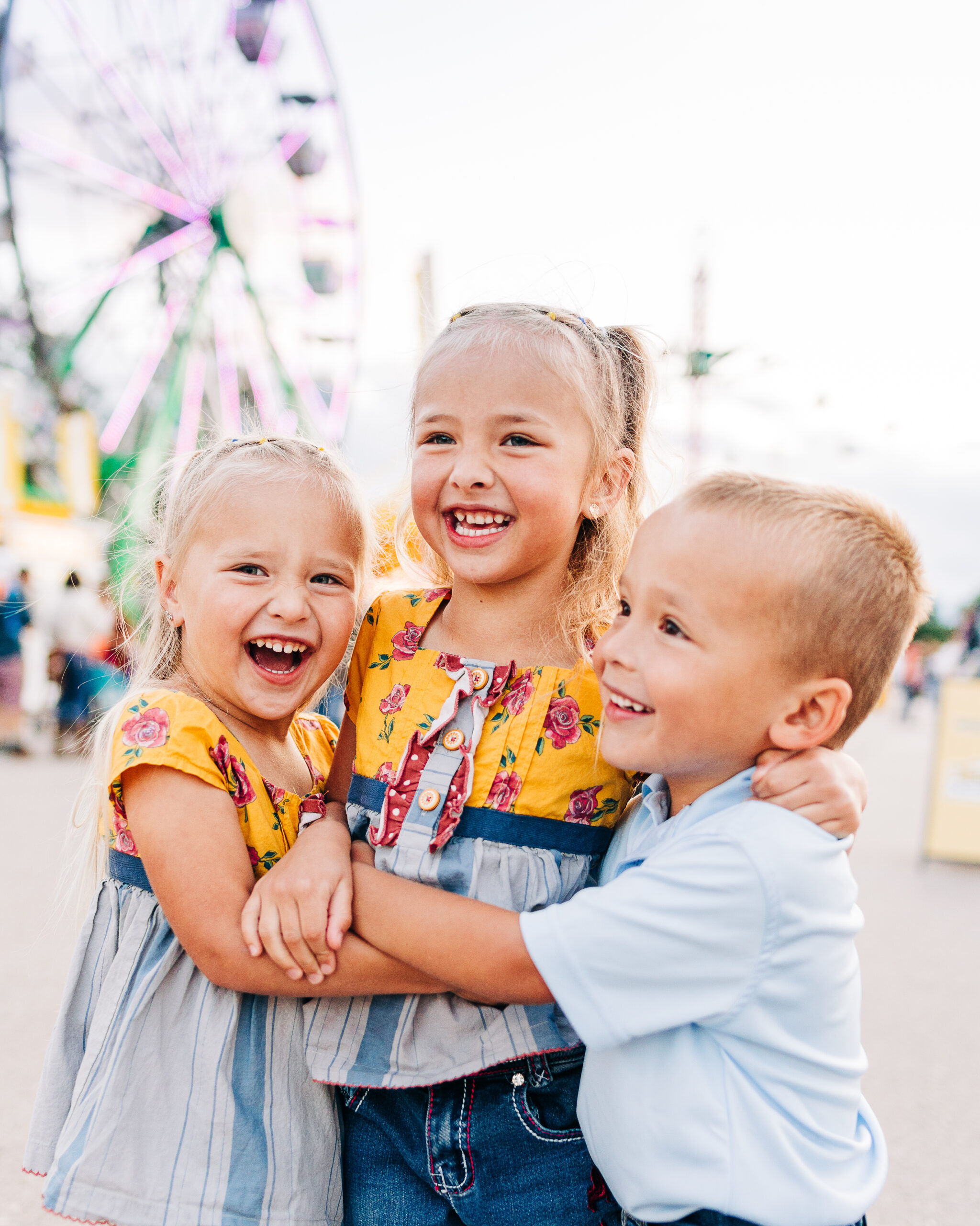 three toddlers at carnival at Central States Fair in Rapid City, SD