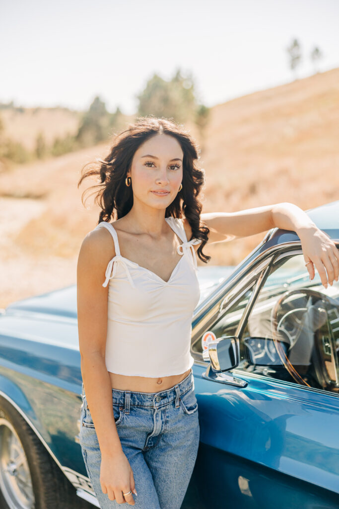 senior girl with classic shelby mustang